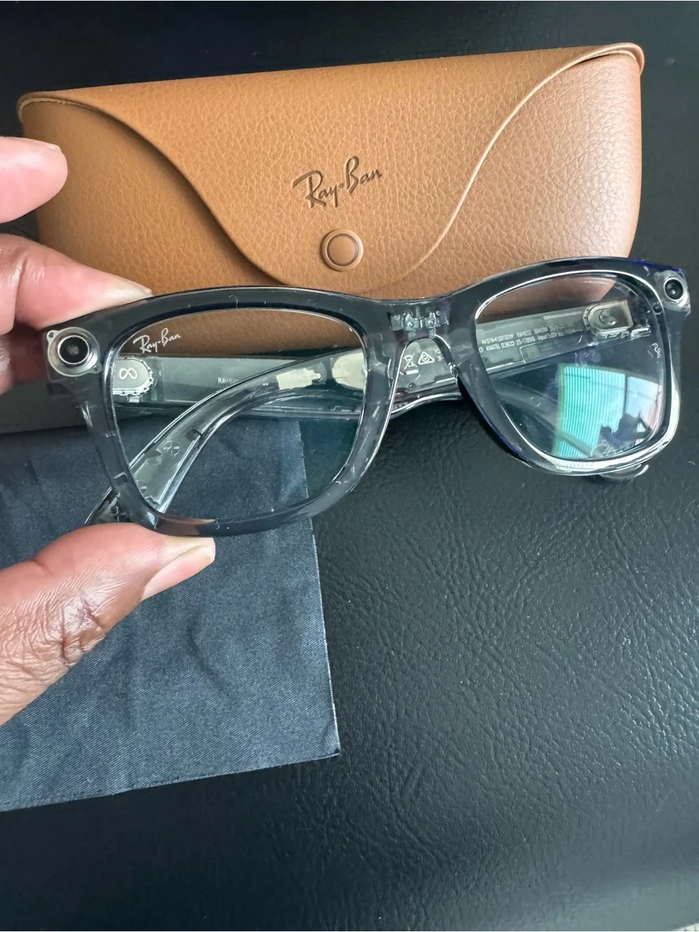 Meta Ray-Ban AI transitional Sunglasses with charging case.